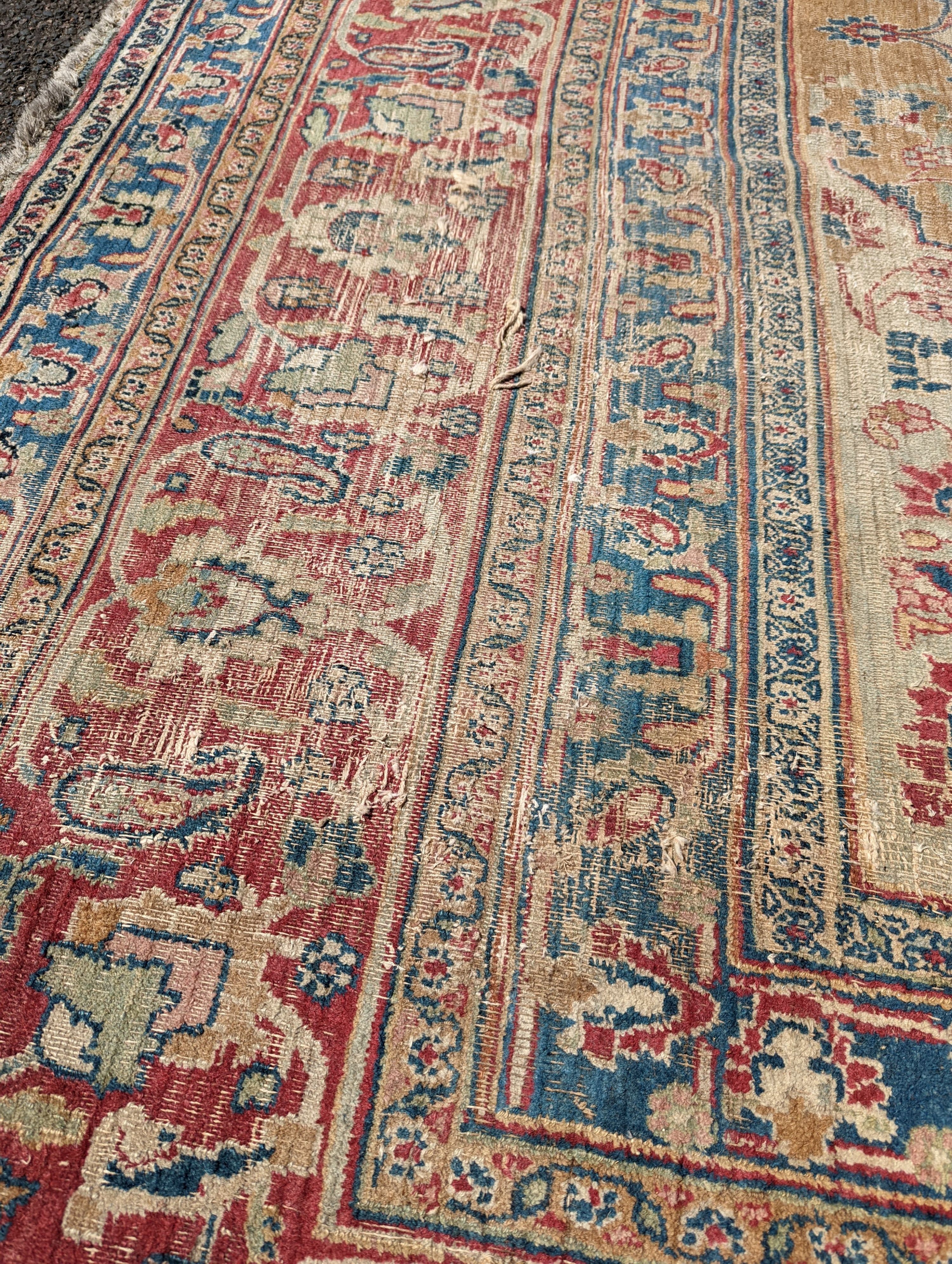 An Isfahan ivory ground carpet, 432 x 330cm